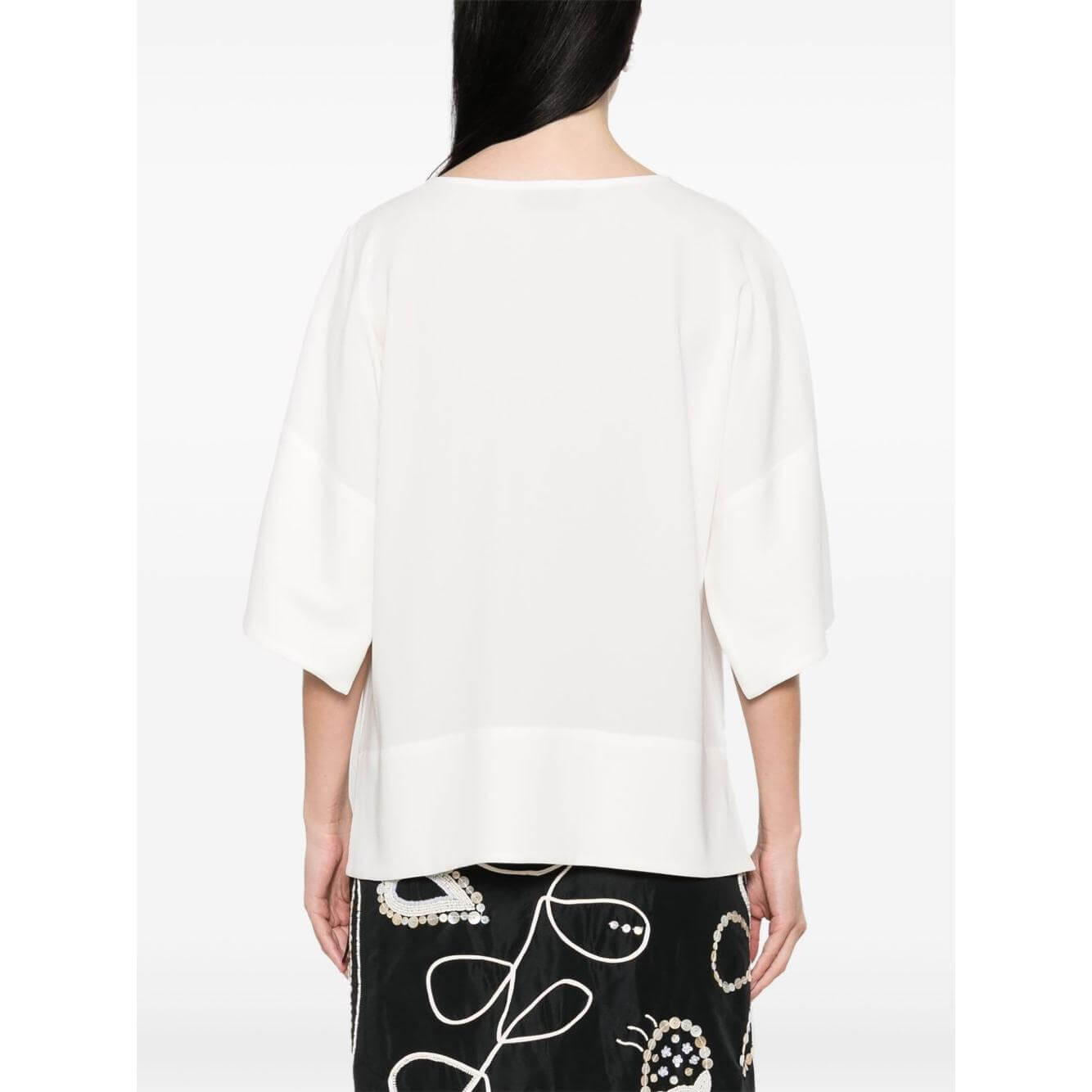 Back view of Alberto Biani Cady blouse with drop shoulder, three-quarter sleeves, and side slits in white, size 40 IT.