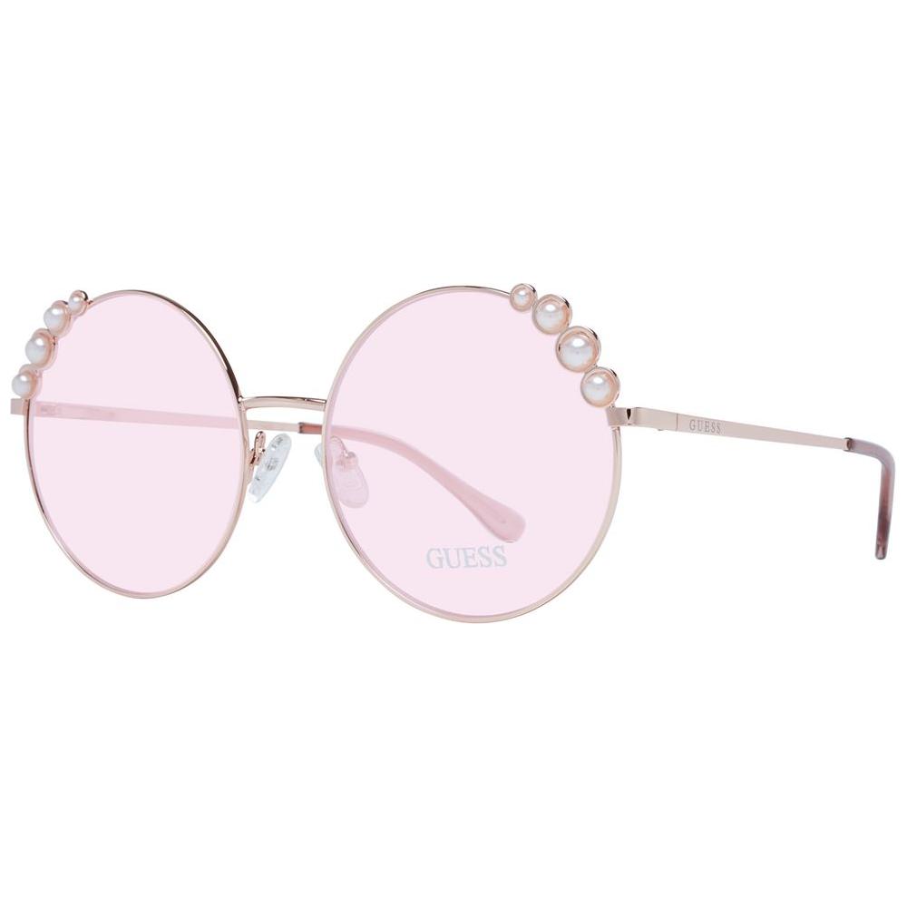 Guess rose gold round women's sunglasses with rose lenses, metal frame, and pearl accents, offering 100% UVA & UVB protection.