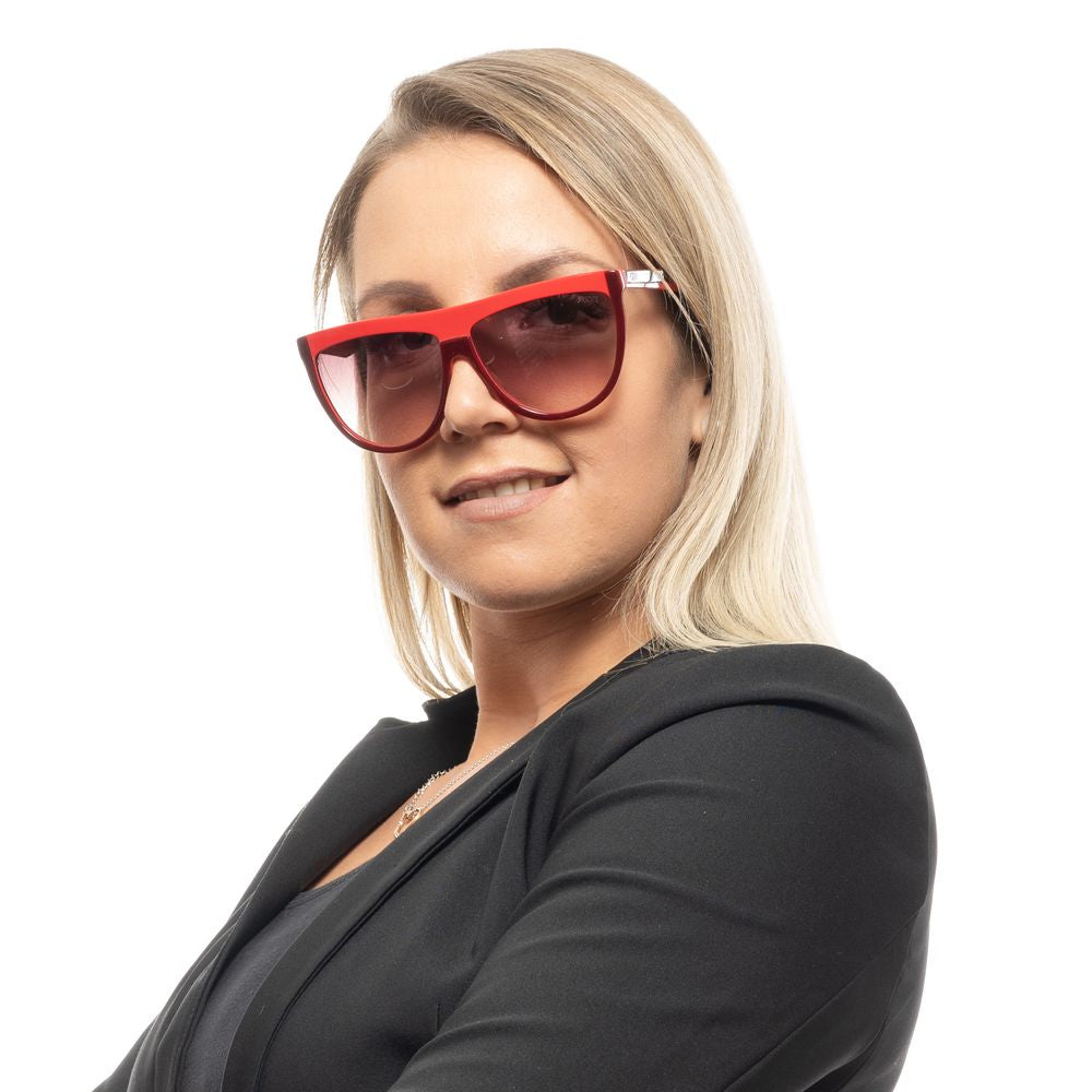 Woman wearing Emilio Pucci burgundy oval sunglasses with brown gradient lenses and full-rim plastic frame.