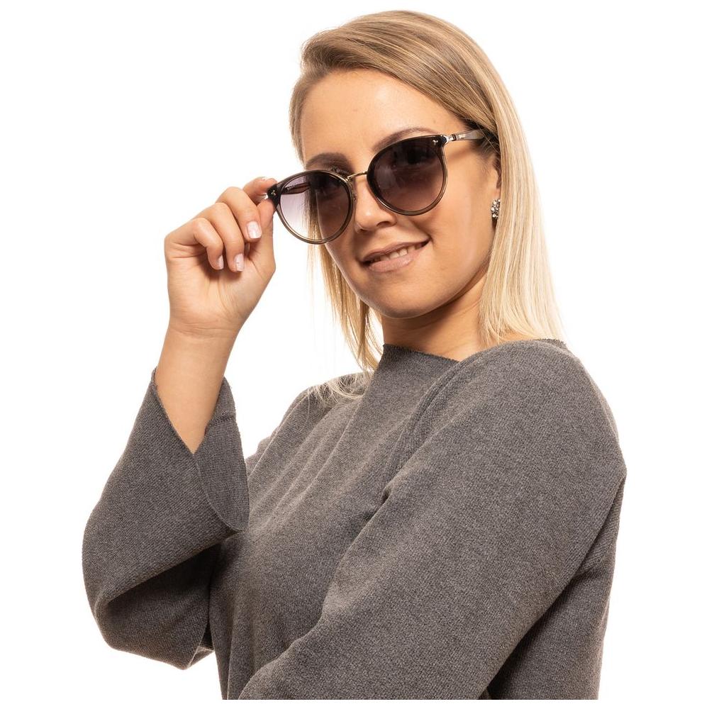 Woman wearing Bally Black Round Women Sunglasses with gradient lenses, showcasing stylish full-rim metal & plastic frame. 100% UV protection.
