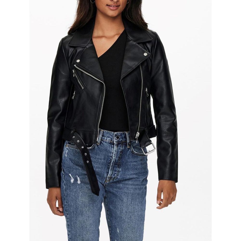 Woman wearing Only Black faux leather biker jacket with zippers and lapel collar, paired with casual jeans. Trendy and bold fashion.