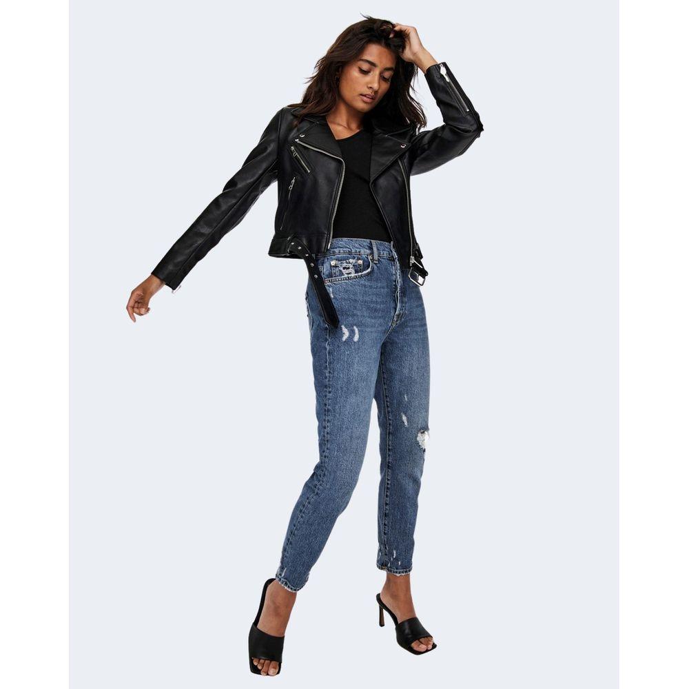 Woman wearing Only ONLVERA faux leather biker jacket in black with zippers and lapel collar, paired with blue jeans and heels.
