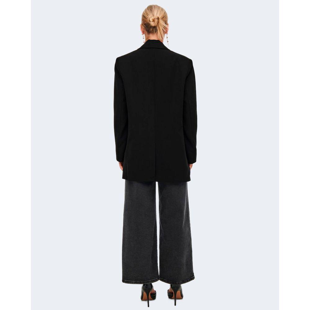 Back view of woman wearing Only ONLLANA-BERRY black polyester blazer with oversized fit, styled with wide-leg pants.