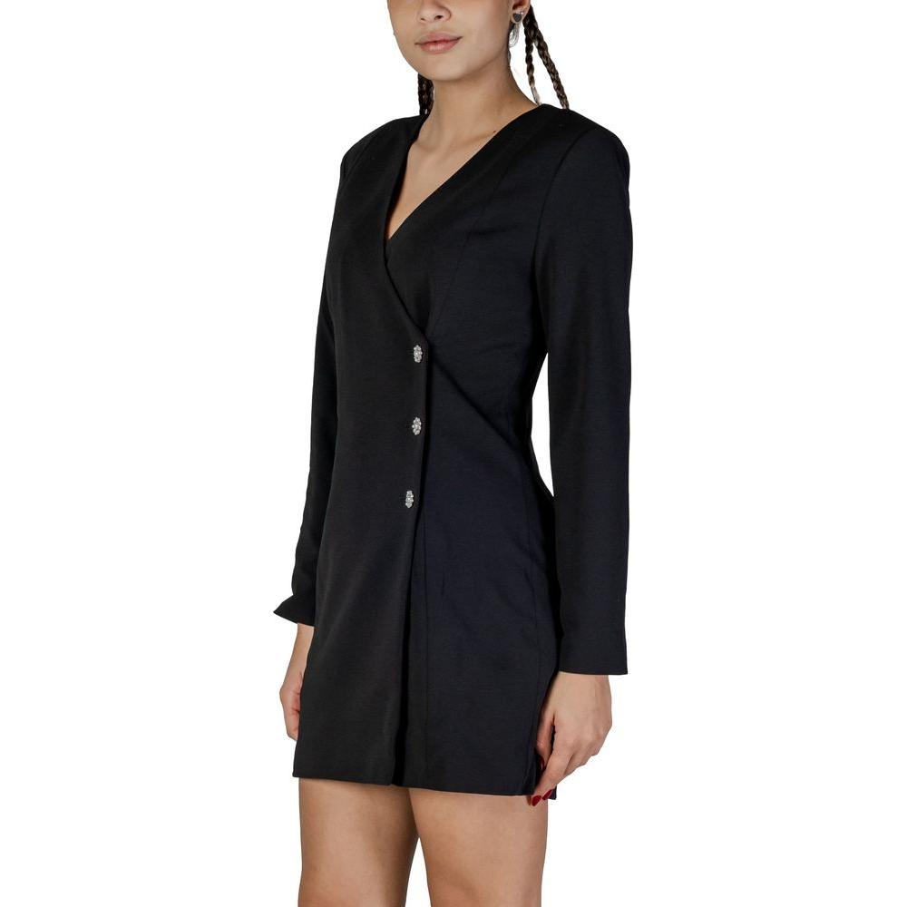 Women's short black polyester dress with long sleeves, perfect for fall and winter. Elegant and modern style ideal for any occasion.