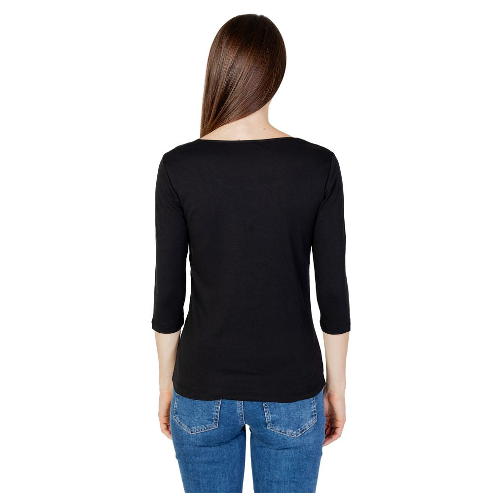 Woman wearing Street One black cotton long sleeve T-shirt, autumn/winter collection, back view.