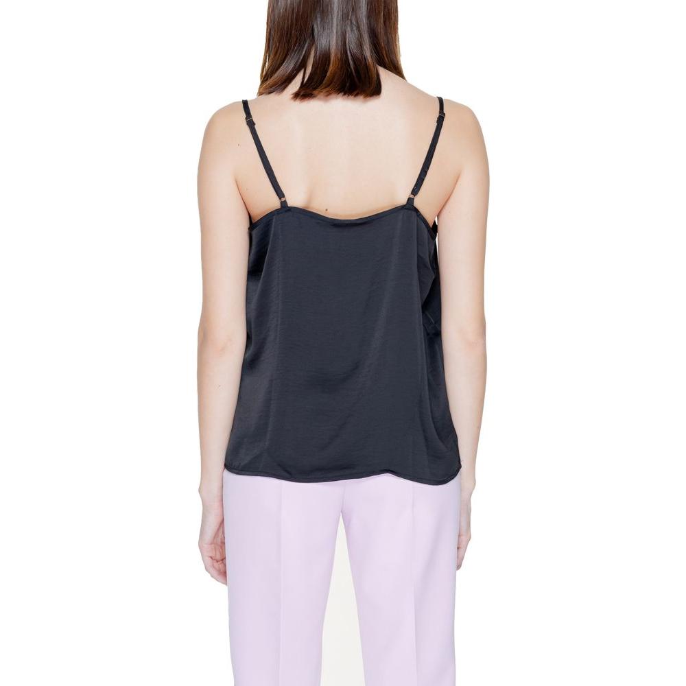 Back view of a woman wearing a Jacqueline De Yong black polyester tank top from the spring/summer collection.