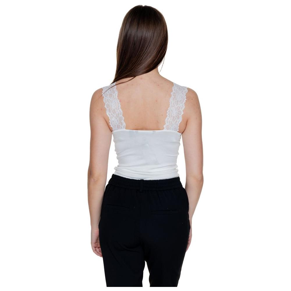 Back view of woman wearing Vero Moda white viscose tank top, part of spring/summer collection, featuring lace straps.