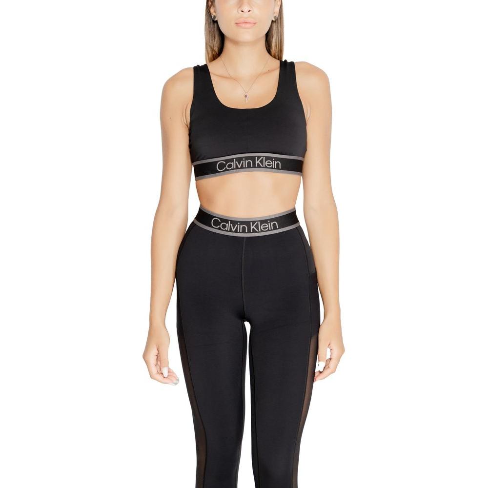 Calvin Klein Sport WO black sports bra and leggings with logo, seamless design, providing optimal support and comfort for fitness.
