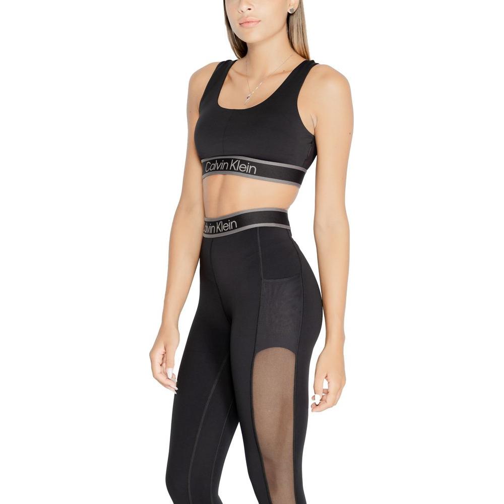 Calvin Klein Sport Black Polyester Sports Bra and Leggings with Logo Band, Seamless Design for Comfort and Support, Model Wearing.