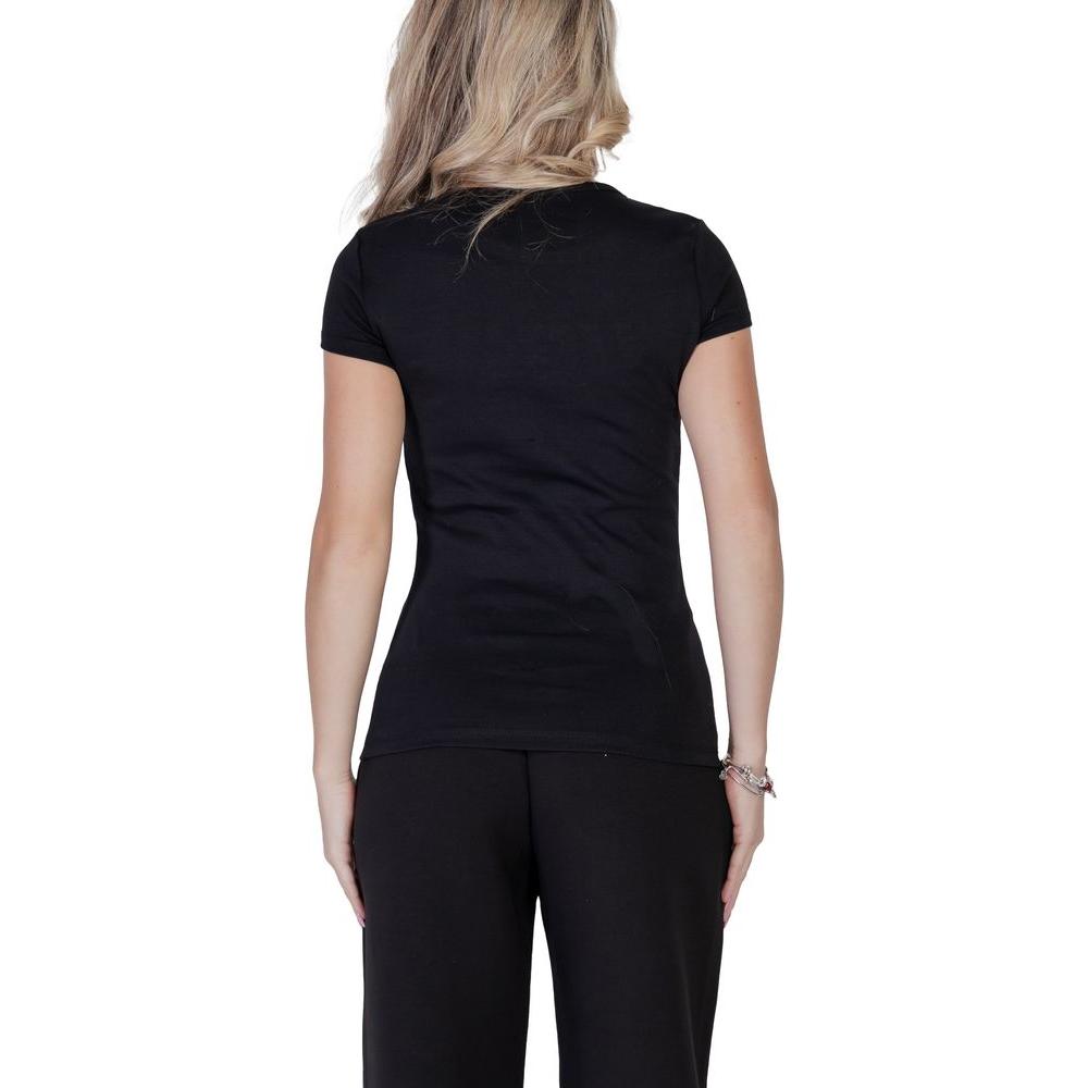 Back view of woman wearing black Guess Active short-sleeve cotton t-shirt highlighting fitted cut and style.