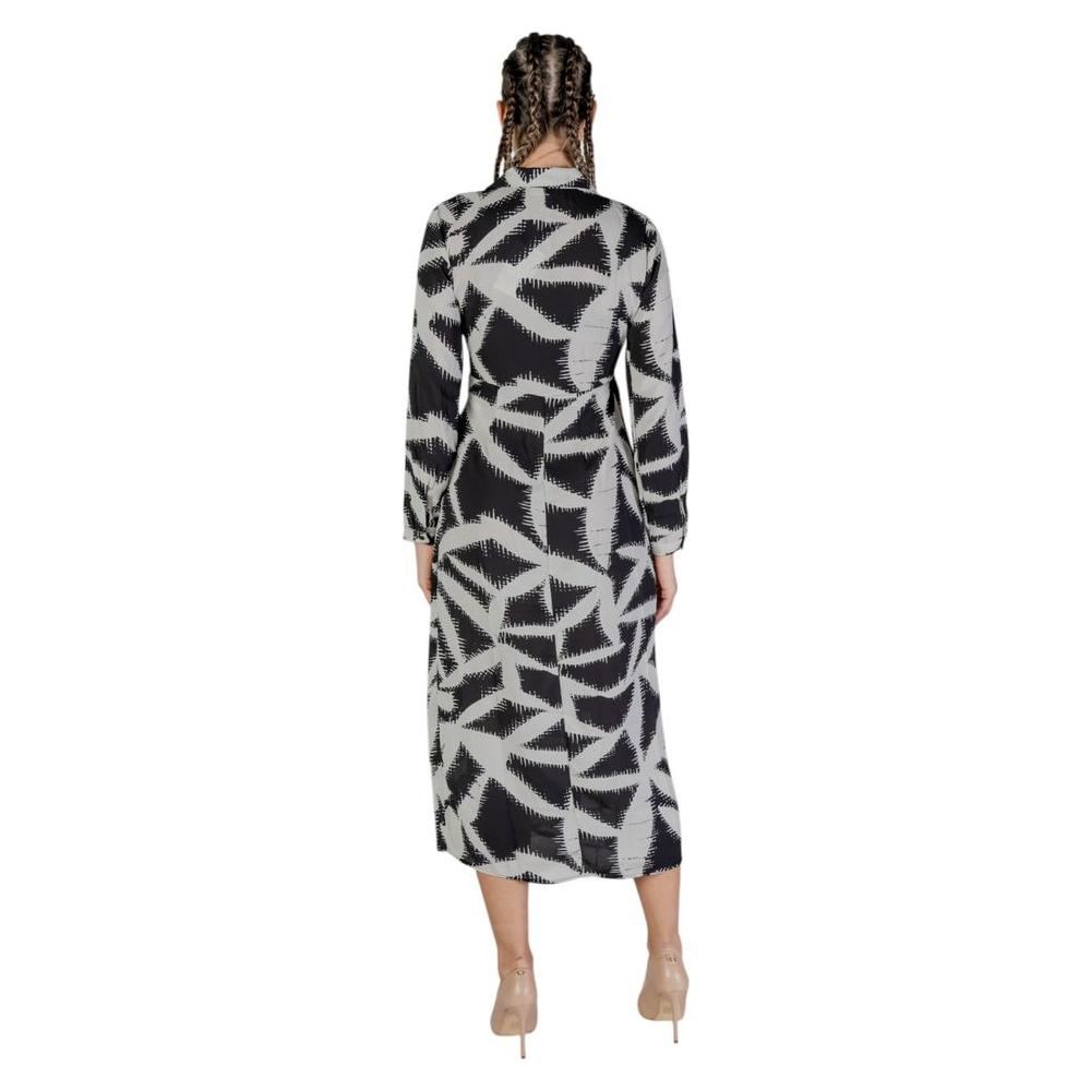 Back view of a Jacqueline De Yong black recycled polyester long dress for women, featuring a geometric pattern in the fall/winter collection.