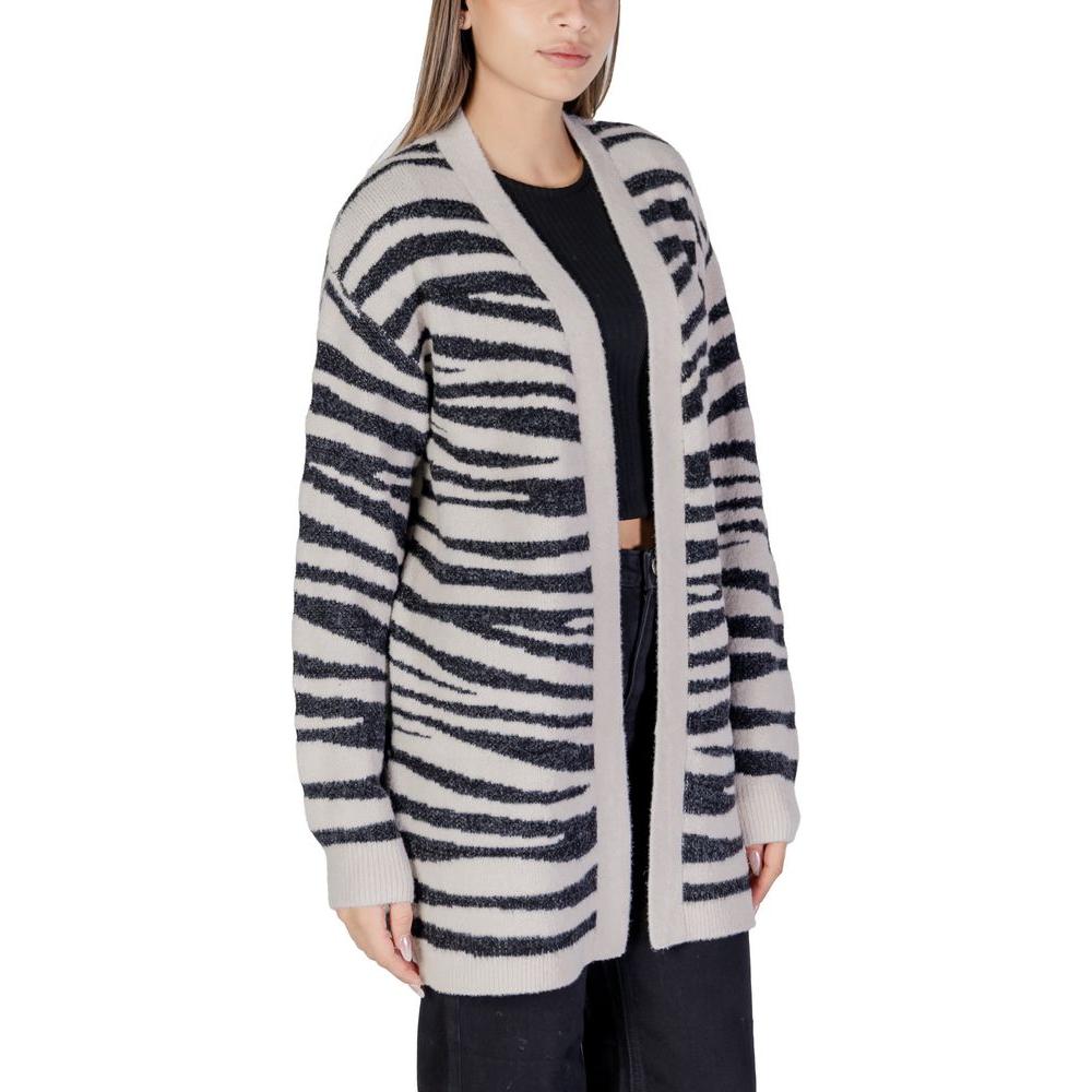 Woman wearing Jacqueline De Yong gray nylon cardigan with zebra print design, part of fall/winter women's knitwear collection.