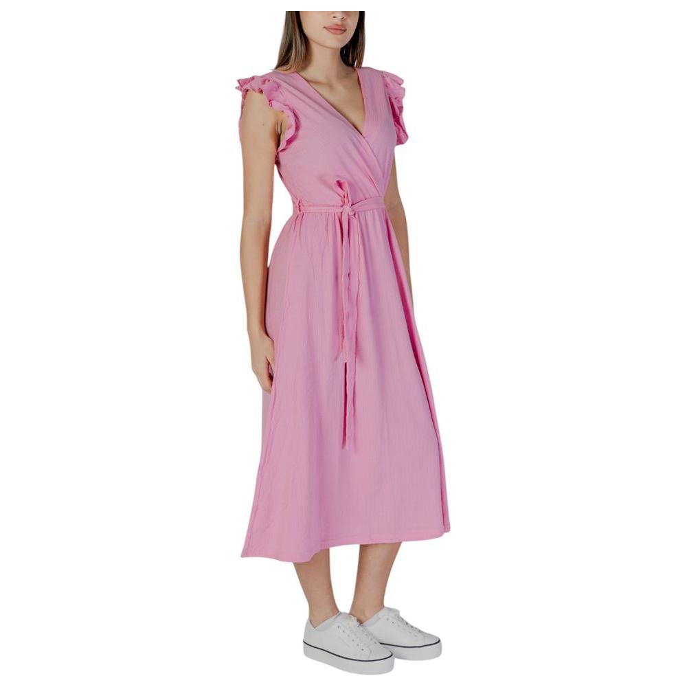 Woman wearing B.Young multicolor cotton dress, perfect for spring and summer fashion, showcasing trendy style with comfortable fit.