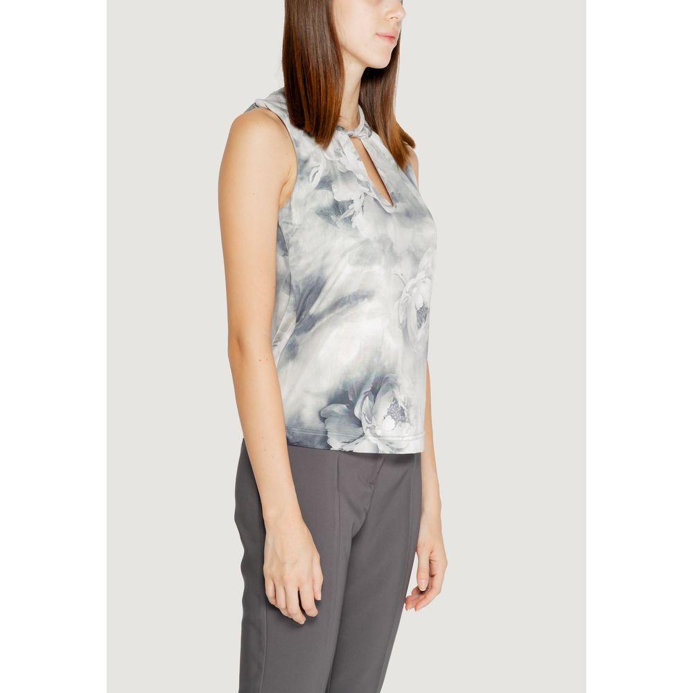 Woman wearing Rinascimento gray polyester top with abstract design, part of the Fall/Winter collection, 92% polyester and 8% elastane.