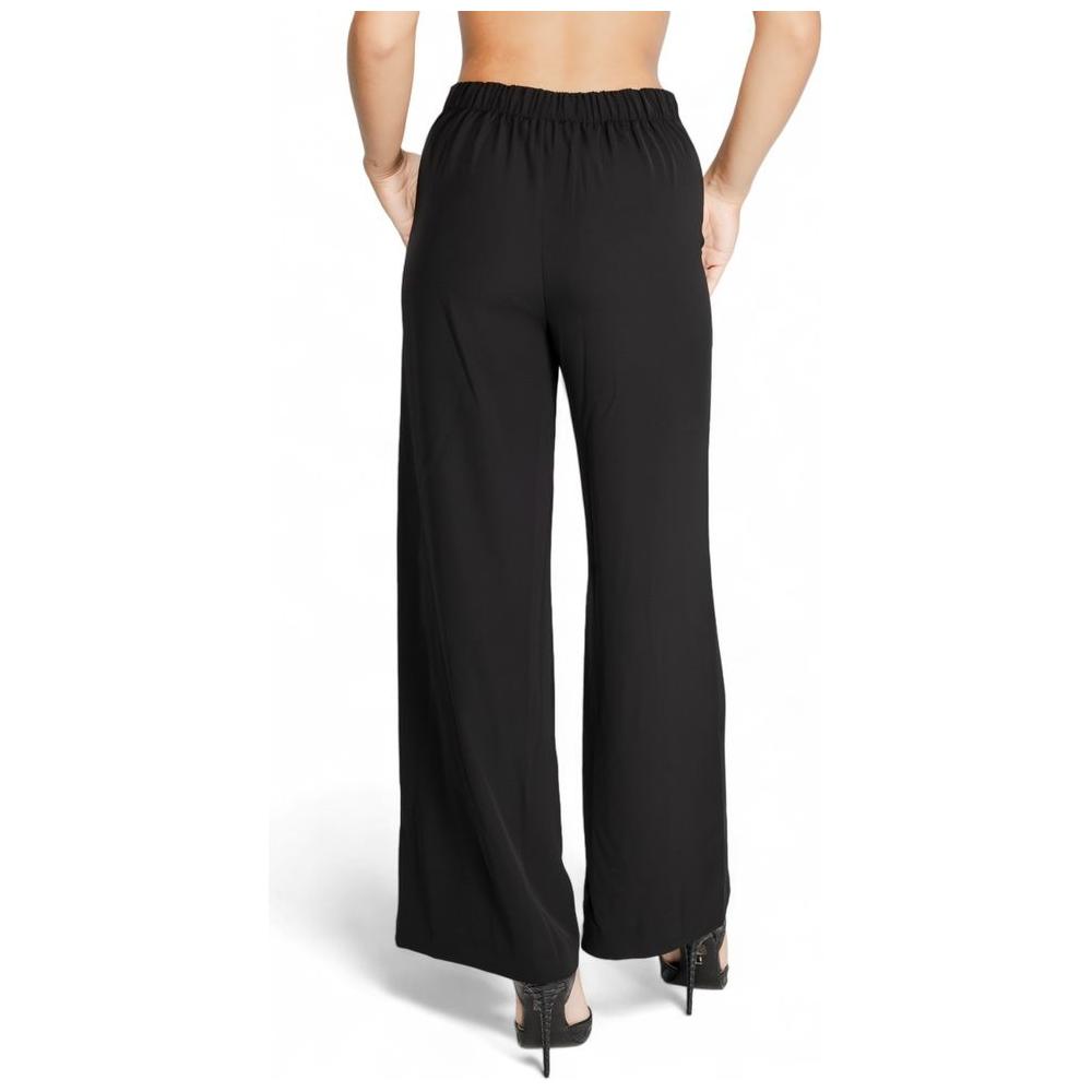 Back view of Rinascimento black women's polyester pants, fall/winter collection, with elastic waistband and wide-leg fit.