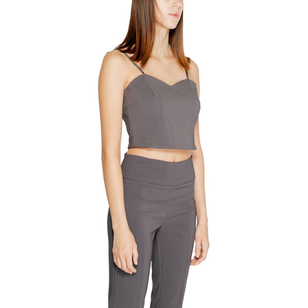 Woman wearing Rinascimento gray polyester crop top from Fall/Winter collection, with 90% polyester and 10% elastane.