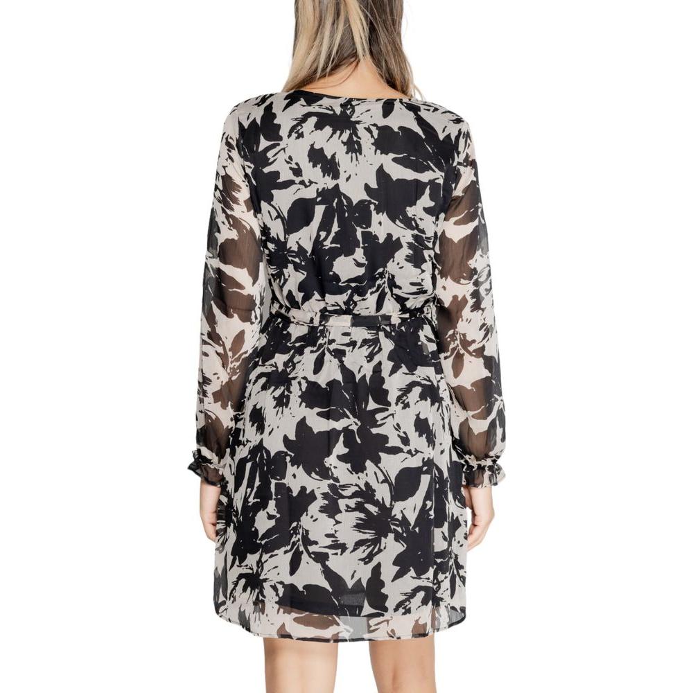 Back view of a Jacqueline De Yong black recycled polyester dress, featuring a floral pattern, ideal for fall and winter women’s fashion.
