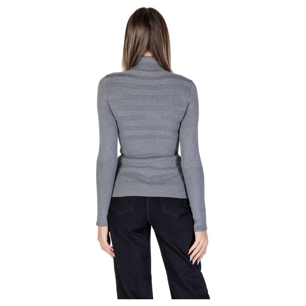 Back view of a woman wearing a Morgan De Toi gray viscose sweater, part of the women's knitwear fall/winter collection.
