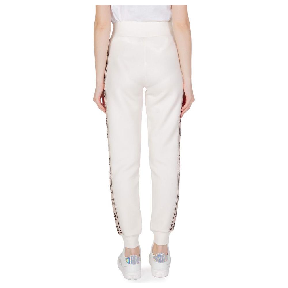 Back view of Guess Active Britney Jogger sweatpants in cream cotton showcasing elastic waistband and side branding detail.