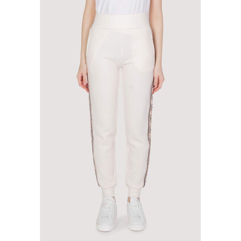 Woman wearing Guess cream cotton joggers with elastic waistband and side design, perfect for casual wear and sports activities.