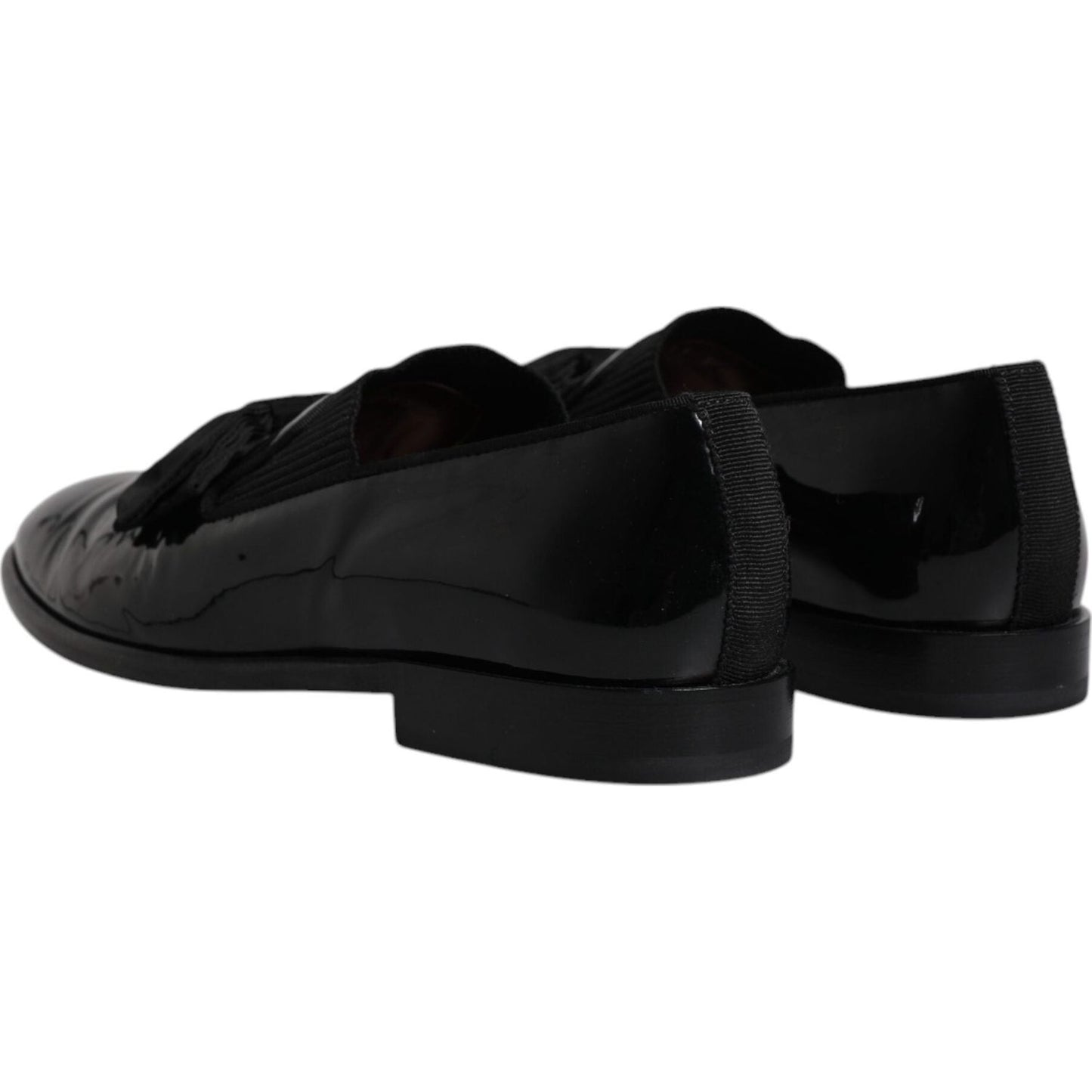 Dolce & Gabbana black leather loafers for men, formal dress shoes, showing elegant design and craftsmanship, slightly preowned condition.