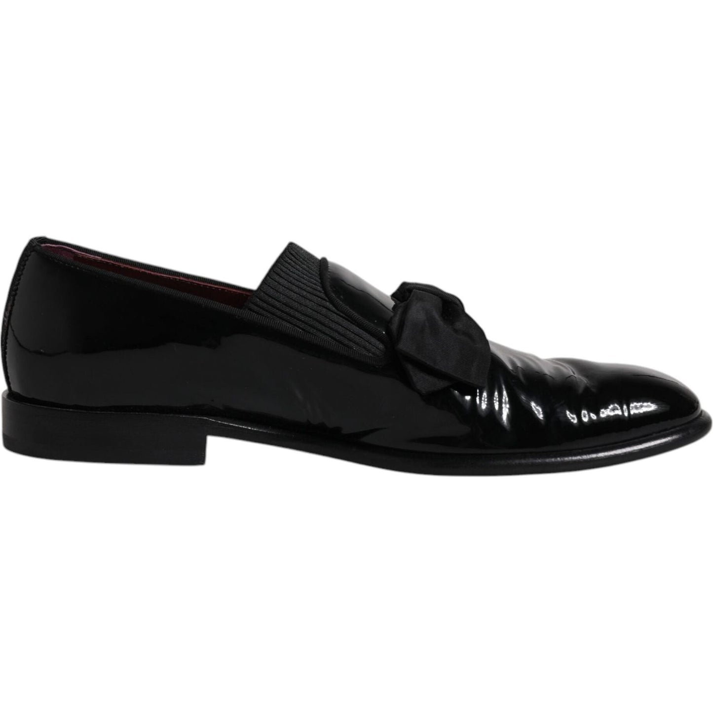 Dolce & Gabbana black leather loafers for men, formal dress shoes with logo detail, made in Italy, slightly preowned, elegant design.