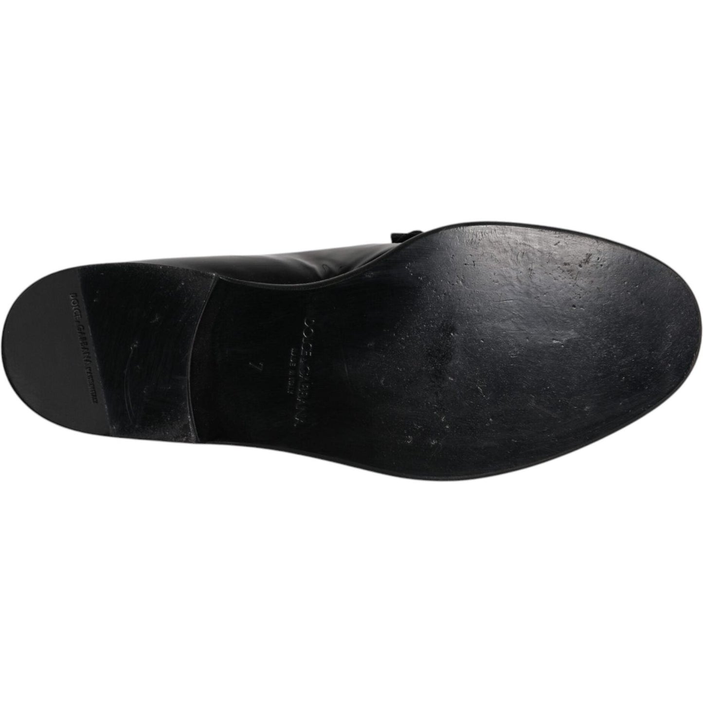 Sole of Dolce & Gabbana black leather loafers showing slight wear.