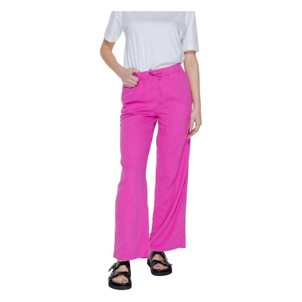 Pink linen palazzo trousers for women, spring/summer collection, with 55% linen and 45% viscose composition, styled casually.