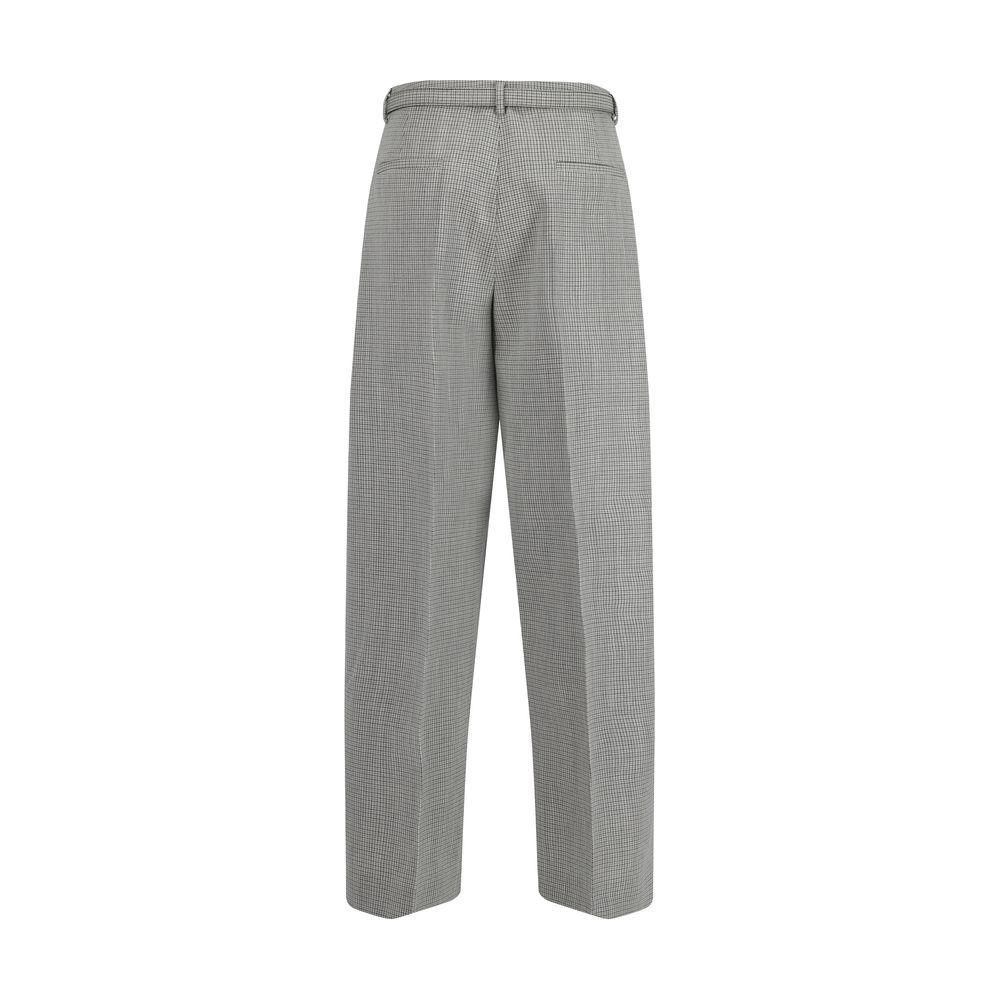 Back view of Jil Sander virgin wool wide-leg pants with belt loops and welt pockets, showcasing sleek, contemporary design.