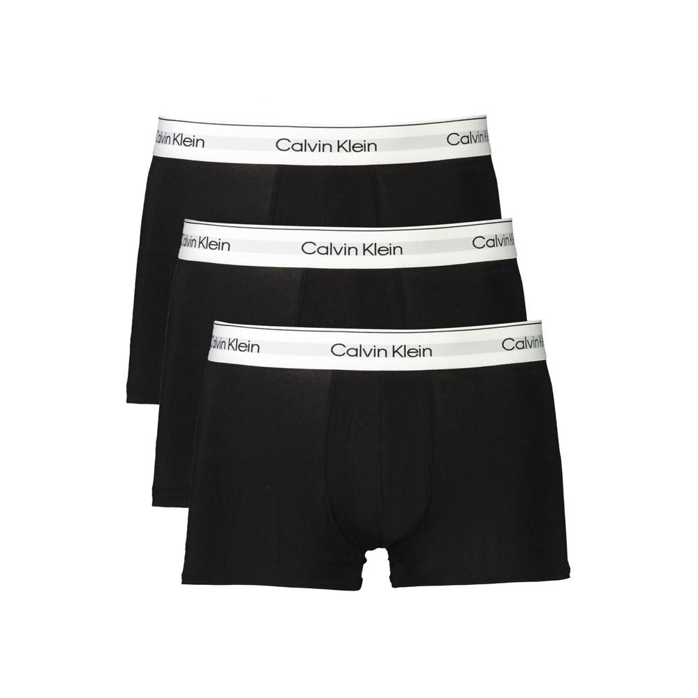 Calvin Klein black cotton men's boxer shorts tri-pack with logo waistband, low-waist design, 95% cotton and 5% elastane for comfort and fit.