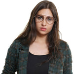 Woman wearing Tod's Brown Women Glasses Frame in metal and plastic, full-rim, with a plaid jacket.