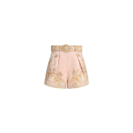 Zimmermann Acacia Tuck Shorts with paisley pattern, adjustable belt, concealed zipper, side pockets, and waistband loops in pink and gold.