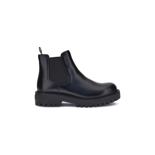Black rubber boot on a white background