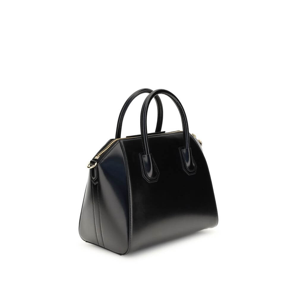 Givenchy Black Calf Leather Bos Taurus Handbag with gold accents and adjustable strap, showcasing luxury and style.