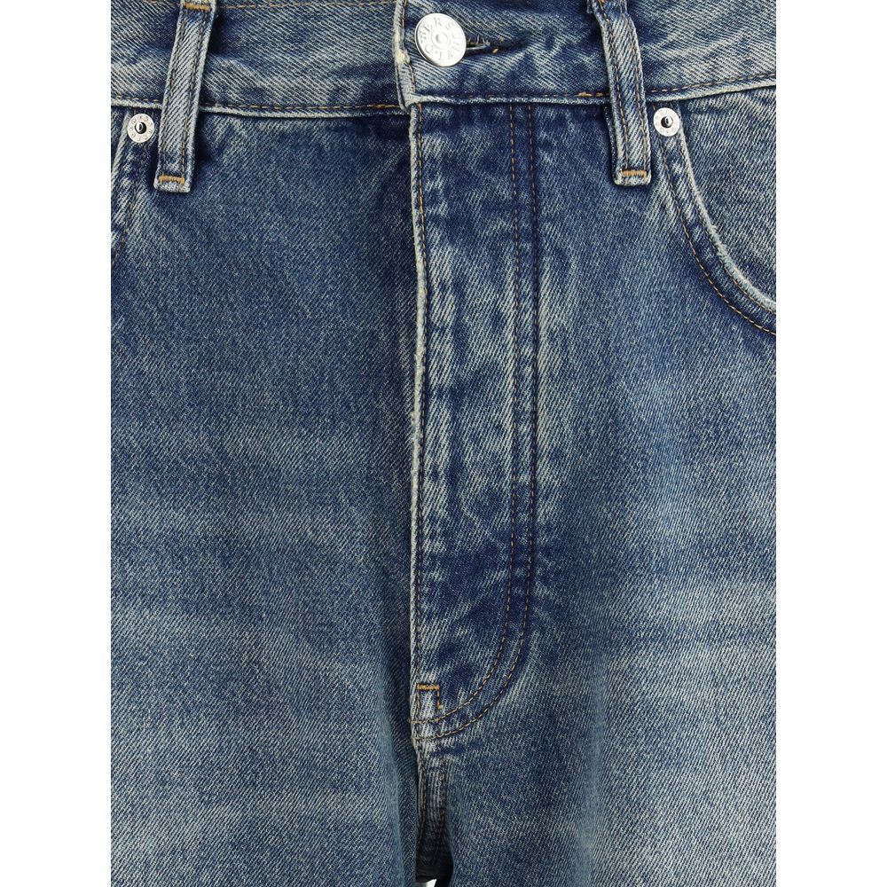 Close-up of Sunflower Blue Cotton Jeans Denim with vintage wash and recycled metal trim, showcasing twisted wide denim detail.