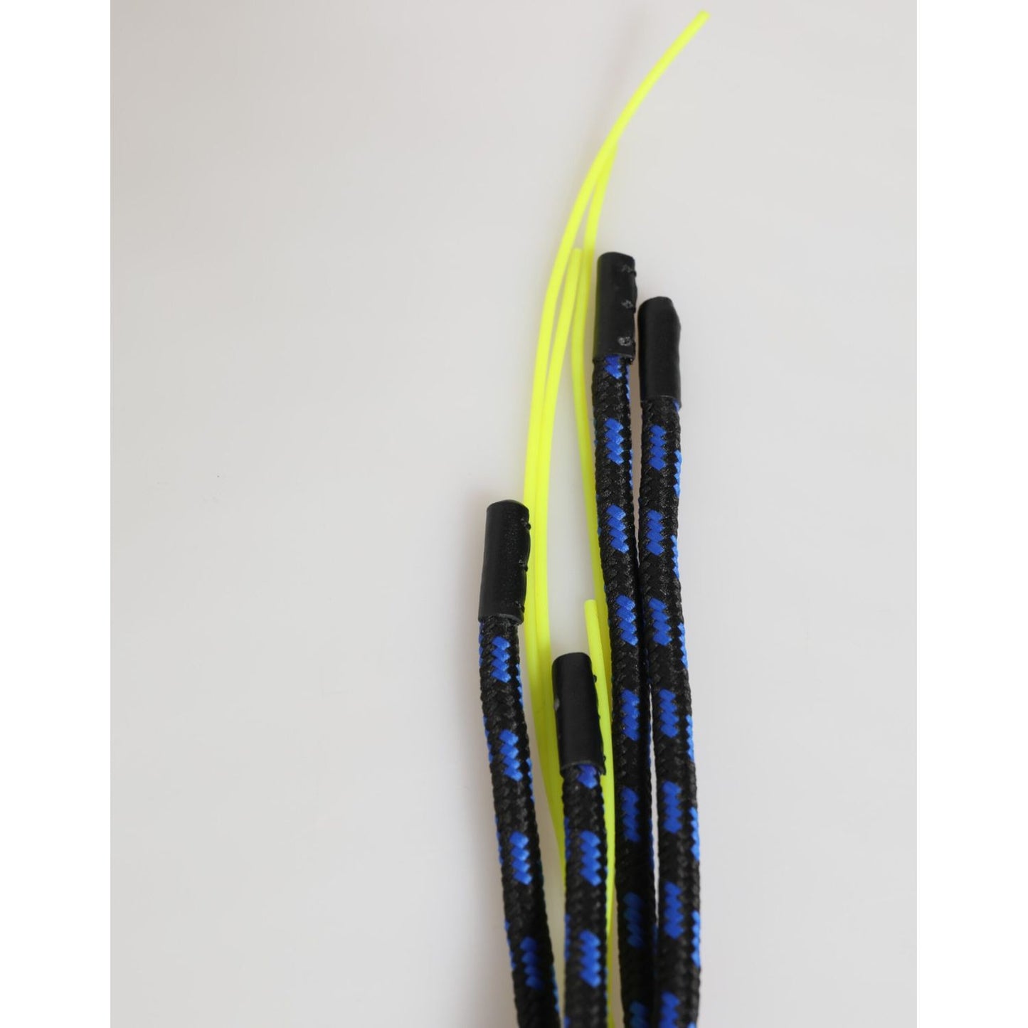 Climbing rope cord with blue and neon yellow strands, isolated on a light gray background.
