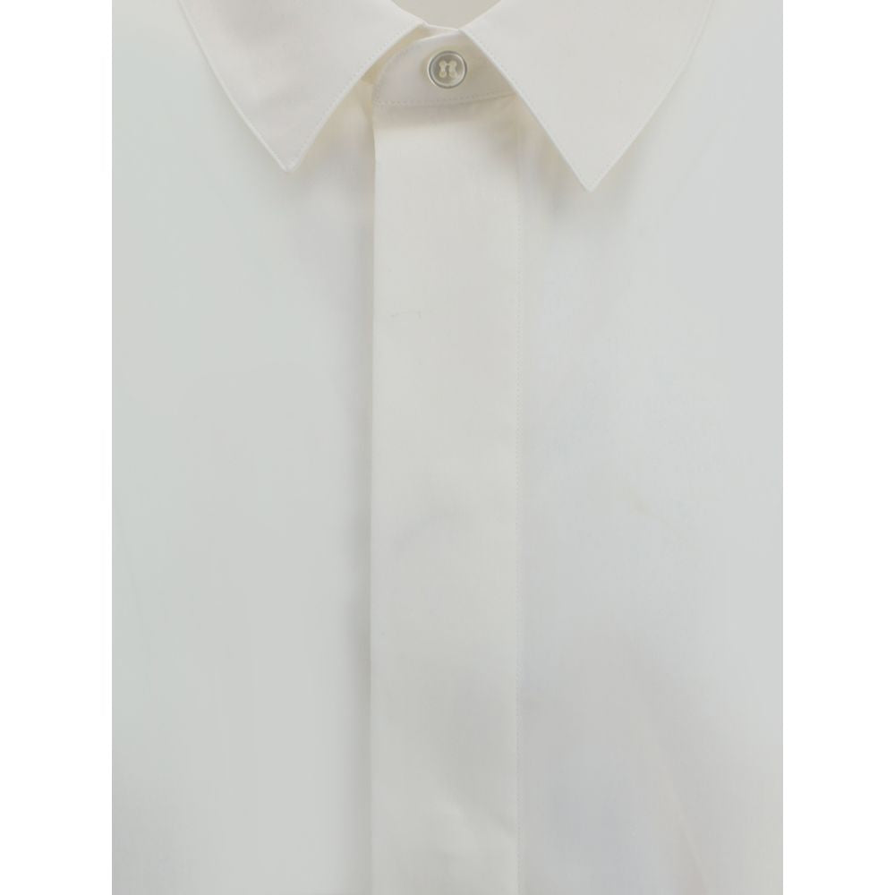 Saint Laurent White Cotton Dress Shirt with classic collar and concealed buttons, featuring embroidered logo for sophisticated style.