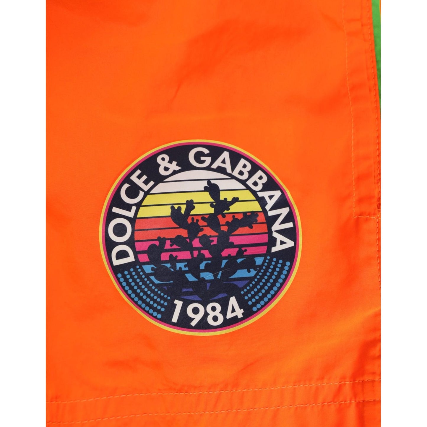 Dolce & Gabbana Orange Polyester Beachwear Men Shorts Swimwear with logo detail, elastic waist, and drawstring closure