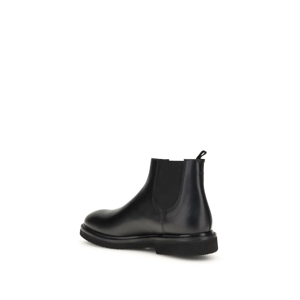 Premiata Chelsea Ankle Boots in dark brown calfskin leather with Goodyear workmanship and leather sole, side view.