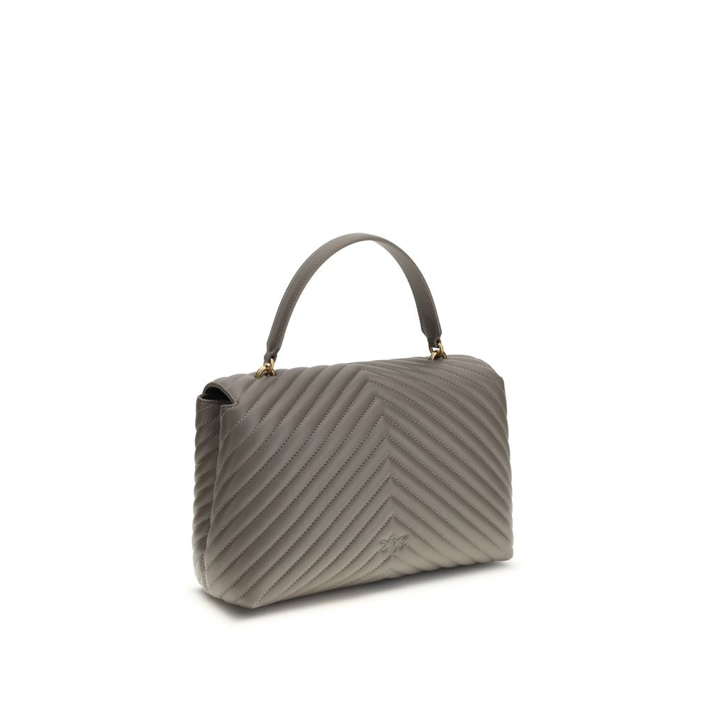 Front view with bag zipped and handles upright.