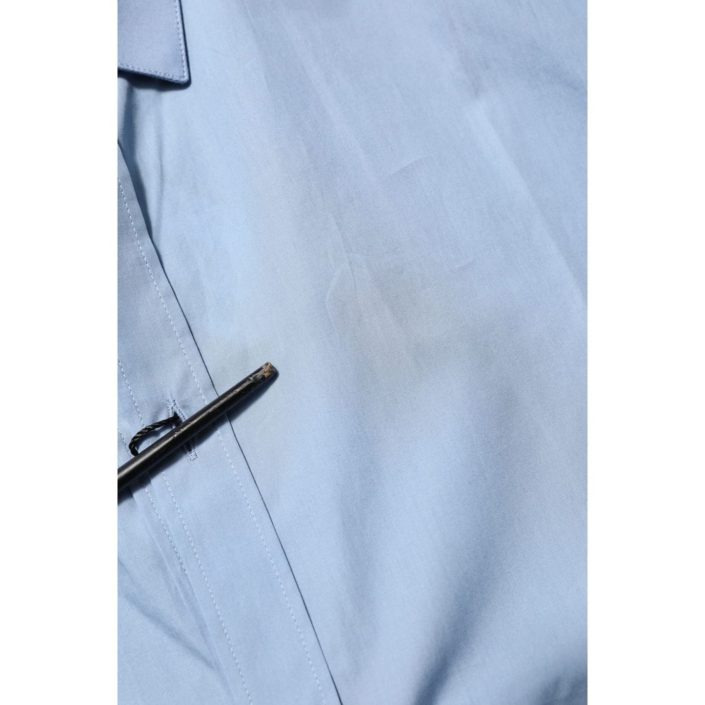 Close-up of Dolce & Gabbana Blue Cotton Collared GOLD Formal Dress Shirt showcasing high-quality fabric and gold accents.