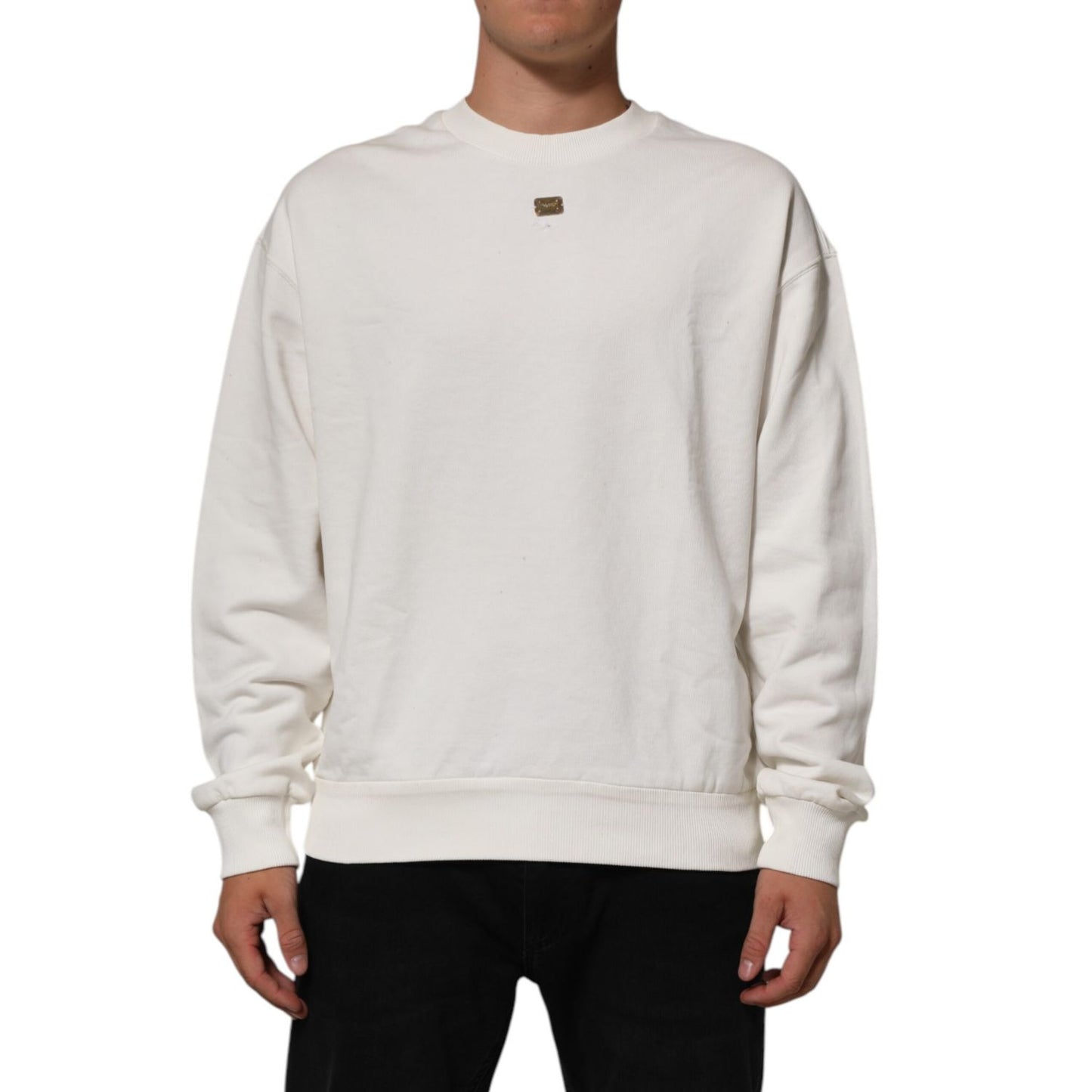 Dolce & Gabbana White DG Logo Crew Neck Sweatshirt Sweater shown on model, featuring signature logo plaque and ribbed cuffs.