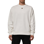 Dolce & Gabbana White DG Logo Crew Neck Sweatshirt Sweater shown on model, featuring signature logo plaque and ribbed cuffs.