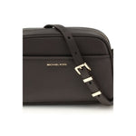 Michael Kors Jet Set Bag with adjustable shoulder strap and gold-tone details, showcasing front pocket and elegant design.