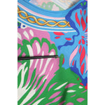 Close-up of Dolce & Gabbana Multicolor Floral Printed Tunic Blouse Top, showcasing vibrant floral patterns on lightweight fabric.