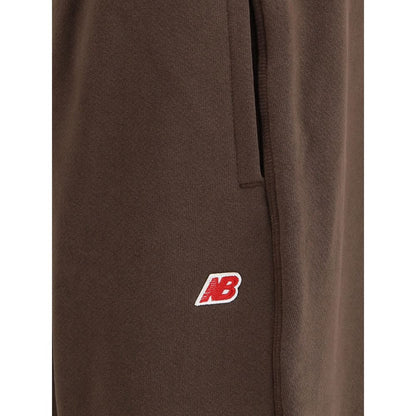 New Balance Brown Cotton Joggers (Workout Pants) with logo patch and elasticated waistband, AW25 collection.