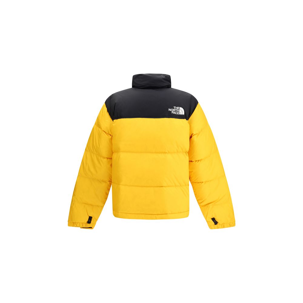 The North Face Yellow Polyamide Shell Jacket with bold yellow and black color, padded design, featuring high collar and removable hood.