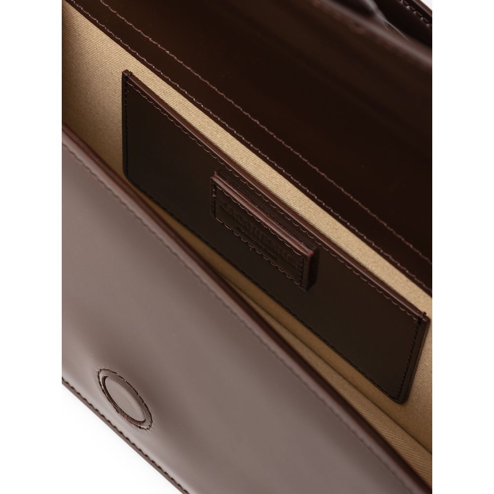 Interior view of Jacquemus Brown Leather Handbag showcasing its pocket and lining details.