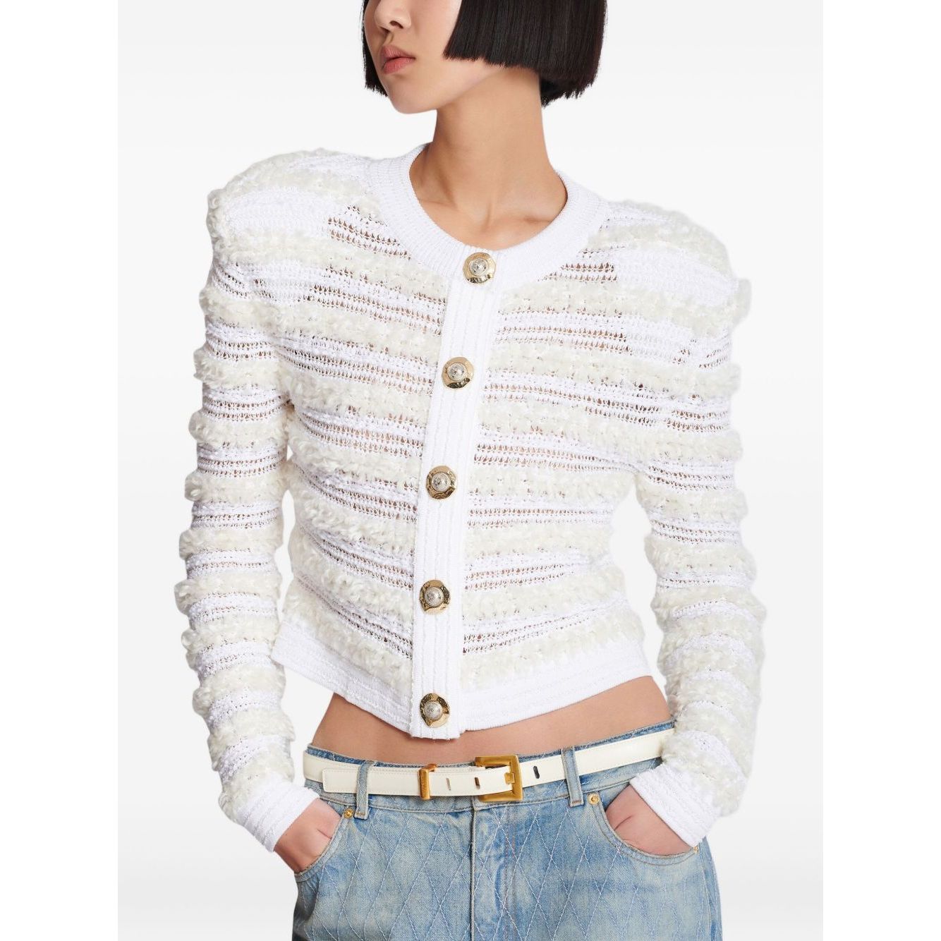 Balmain Long-sleeved tweed-effect knit cardigan in white with front button fastening and ribbed trim, worn by model.