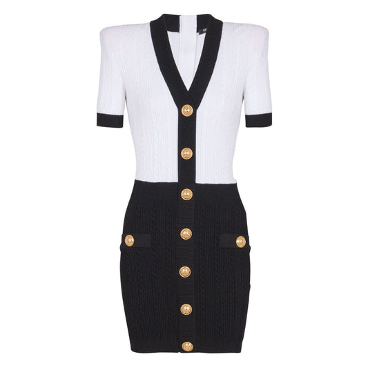Balmain Two-tone twisted knit bodycon dress with white rear zip fastening, V-neck, short sleeves, thigh-length, and gold button detail.